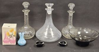 A pair of Victorian lens cut shaft and globe shaped decanters and stoppers, together with a boxed