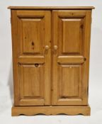 Pine cupboard, two two panel doors opening to a shelf, 101cvm high x 72cm wide x 38cm deep and a