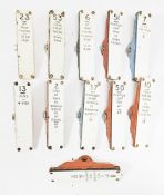 11 mainly British Rail Traffolite signal box lever plates mounted on cast iron brackets, various