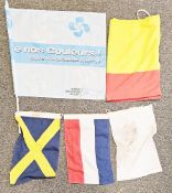 Collection of 14 maritime naval linen flags including a St George flag with navy training corps logo