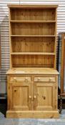 Modern pine dresser, the upper section with three fixed shelves over two frieze drawers and two