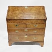 Victorian flamed mahogany bureau, the drop front opening to reveal a selection of fitted drawers and