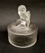 Lalique 'Amour Assis' cylindrical frosted cover, surmounted with a kneeling putto, the side