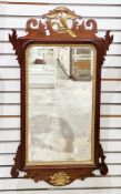 Chippendale-style parcel gilt and mahogany wall mirror with ho-ho bird and scroll pediment, 91cm x