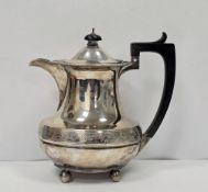 20th century silver coffee pot with wooden handle and knob to lid, raised on four bun feet,