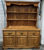 Modern pine dresser, the upper section with two plate shelves, the lower section with three frieze