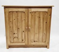 Pine side cabinet, the two panel doors with knob handles opening to two shelves, on square legs,