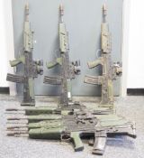 Seven dummy SA80 rifles, moulded rubber body with some metal fittings and metal core.