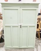 Green painted early 20th century wardrobe, the two panel doors opening to an interior fitted with