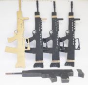 Four plywood cutout SA80s and a further wooden example.