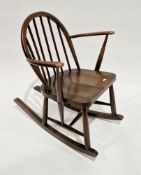 Ercol dark elm seated hoop and stickback low rocking elbow chair, 75cm high x 62cm wide x 73cm
