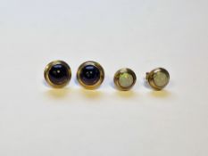 Two pairs of 9ct yellow gold stud earrings, one pair collet set with round amethyst cabochons, the