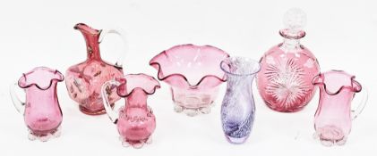Collection of late Victorian cranberry tinted glass including a cut glass compressed oviform