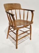 Late 19th/early 20th century beech and elm spindle back tub chair having saddle seat, on turned