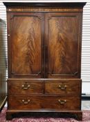 George III mahogany linen press, the moulded cornice with dentil carving, over two cockbeaded