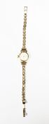 Lady's 9ct gold Longines wristwatch, the circular dial with raised baton hour markers, on 9ct gold