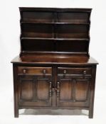 Ercol dark stained elm Old Colonial dresser, model 331D, the upper section with two plate shelves