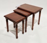 African carved hardwood table of circular form, on a tripod support with figural bust finials,