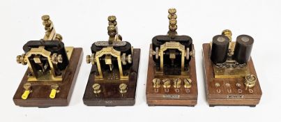 Seven early 20th century electric telegraph sounders, all with brass and bakelite fittings, on