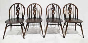 Set of four Ercol dark stained beechwood and elm dining chairs with hoop and spindle backs with