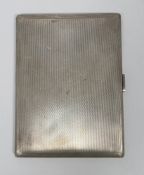 20th century silver cigarette case of rectangular form with engine-turned decoration throughout,