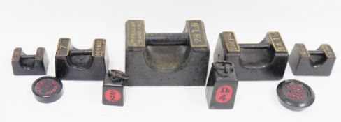 Collection of nine cast iron imperial weights including 28lbs, 14lbs, 7lbs, 4lbs, 2lbs plus 4lb
