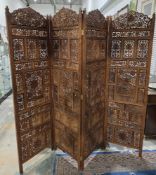 Anglo-Indian hardwood four-fold dressing screen, each panel with pierced carving of flowers and