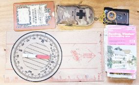 Collection of military cadet training items including compasses, maps, torches, a Silva