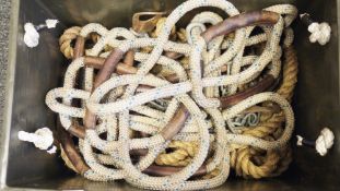 Two climbing ropes, each with four pairs of leather covered integrated handles, on galvanised