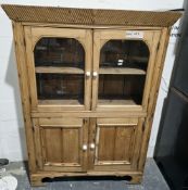 19th century continental pine cupboard, the cornice with carved reeded decoration over two arched