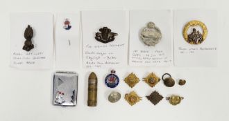 Collection of military items and commemorative items including four military cap badges including