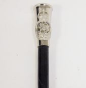 Royal Navy swagger stick, the white metal handle with raised Royal Naval crest, black leather