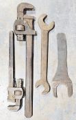 Old pine toolbox and a quantity large spanners, pipe wrenches and other tools