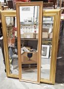 Contemporary giltwood rectangular wall mirror with bevelled glass moulded frame and a further