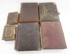 Six Victorian and later photograph albums, some leather bound, including two small albums containing