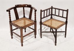 19th century corner chair of square form having bobbin supports, cane seat, the legs united by a