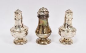 Pair of silver pepperettes, Birmingham 1911, of angular baluster design, 9.5cm high and a silver