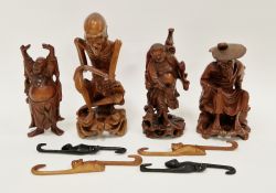 Group of carved Chinese figures of immortals and deities and four carved monkeys, 25cm high max