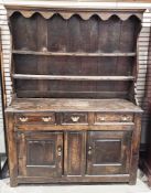 George III oak dresser, the upper section with moulded cornice over two fixed plate shelves,