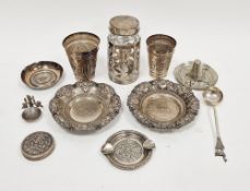 Two South American silver-coloured metal beakers, stamped 925 Peru, decorated with camels and