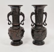 Two Japanese bronze vases, 20th century, cast with birds perched among flowering prunus, with
