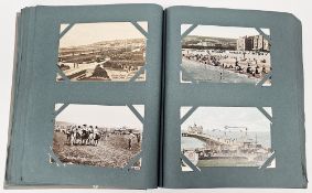 Album of mainly early 20th century postcards, coloured and black and white, some photographic