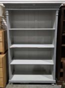 Late 19th/early 20th century pine bookcase, later painted pale blue, the moulded cornice over