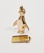 9ct gold pendant of a penguin with gem set eyes, 12.8g approx and a pendant set with a Swiss 1g fine