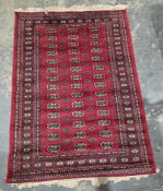 Eastern red ground rug with three rows of 14 elephant foot guls and two rows of 13 hooked