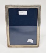Silver photograph frame of rectangular form with bead border, 20cm x 15cm