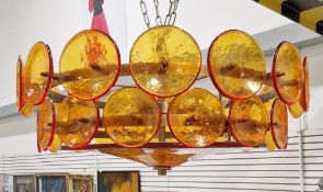 Soho Home Lorenzo chandelier formed from two round tiers of amber glass discs, on a coppered