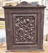 19th / early 20th century dark oak small cupboard, the back rail carved with initials ' A.U.S.',