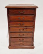 Stained wood filing chest of seven drawers, the top with thumbmould edge, the drawers with metal