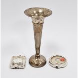 Small silver vase of trumpet shape (weighted base) and two miniature silver photograph frames (